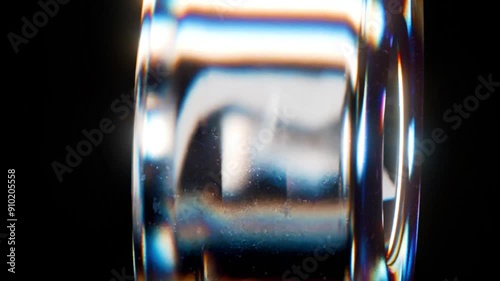 3d render abstract art video animation with surreal glass object in deformation transformation process with dispersion rainbow color spectrum prism effect on isolated black background