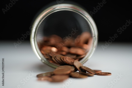 Wallpaper Mural Detail of coins of different currencies coming out of a jar lying on its side Torontodigital.ca