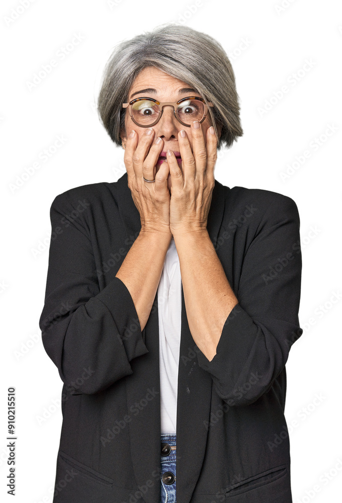 Caucasian mid-age female in business suit laughing about something, covering mouth with hands. Caucasian mid-age female in business suit laughing about something, covering mouth with hands.