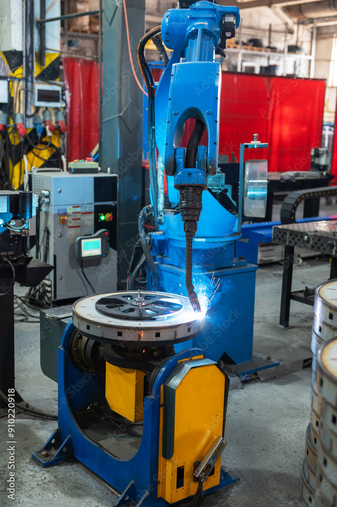 Automatic Industrial welding robot in a modern factory Automatic Industrial welding robot in a modern factory