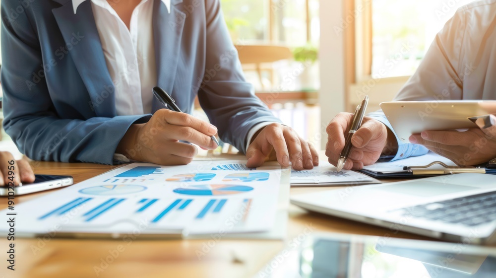Small business owner discussing a business loan with a bank representative. Small business owner discussing a business loan with a bank representative.