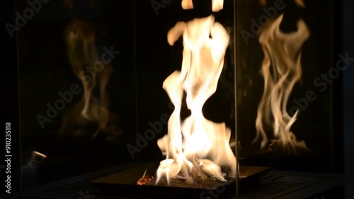 One Bio fireplace burn on ethanol gas. Contemporary mount biofuel on ethanol fireplot fireplace close-up. Modern smart ecological alternative technologies. Interior design of a house inside photo