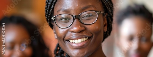  A tight shot of someone wearing glasses, their expression focused In the backdrop, another figure dons a shirt and tie, smiling broadly