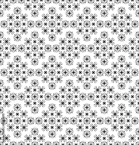 Dense arrangement of geometric floral patterns, creating a rich and detailed design. backgrounds, wallpapers, fabrics, and tiles with a decorative flair.