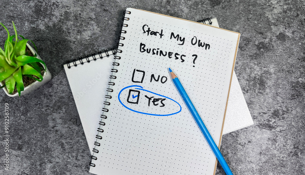 Concept of Start My Own Business. Yes or No write on book isolated on Wooden Table. Concept of Start My Own Business. Yes or No write on book isolated on Wooden Table.