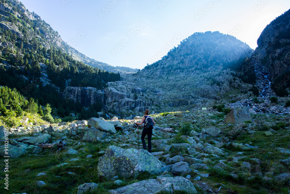 Young hiker woman in Vall de Boi, Aiguestortes and Sant Maurici National Park, Spain Young hiker woman in Vall de Boi, Aiguestortes and Sant Maurici National Park, Spain