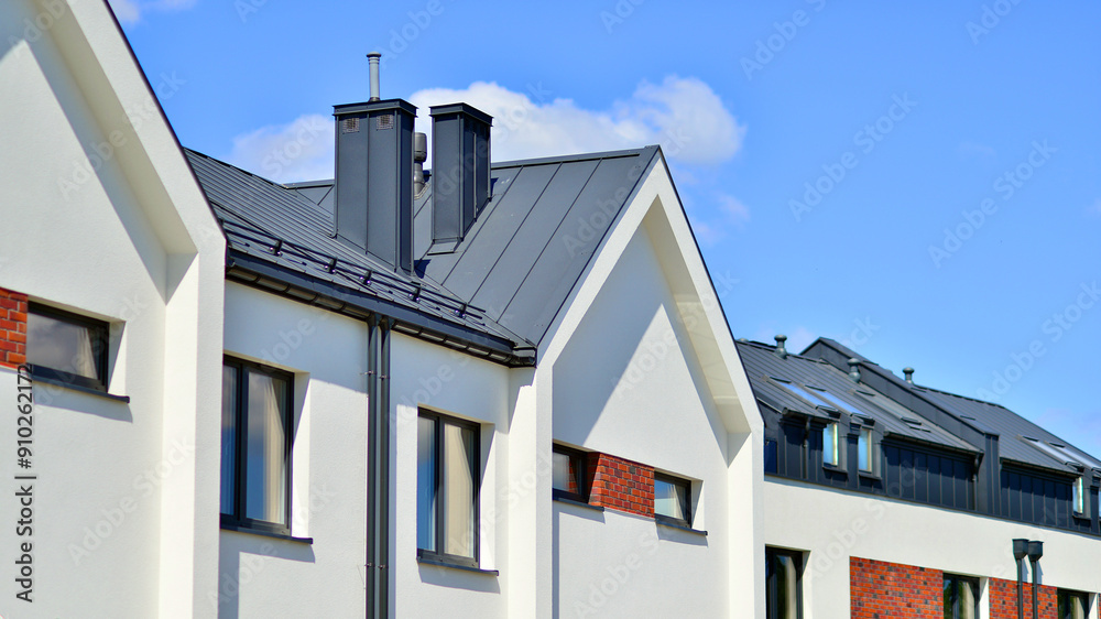 Terraced single family homes in newly developed housing estate. The real estate market in the suburbs. Terraced single family homes in newly developed housing estate. The real estate market in the suburbs.