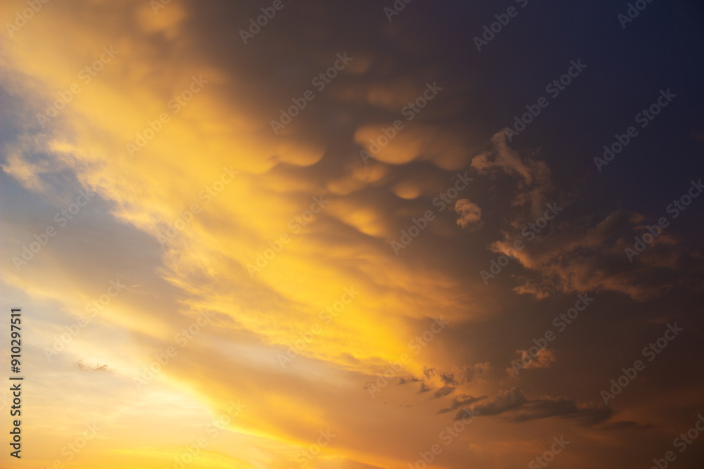 Beautiful sky with unusual red clouds on a sunset. Natural background in orange tones. Beautiful sky with unusual red clouds on a sunset. Natural background in orange tones.