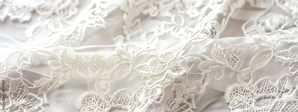 White delicate lace fabric with floral patterns, evoking elegance and romance for wedding and bridal designs. 
