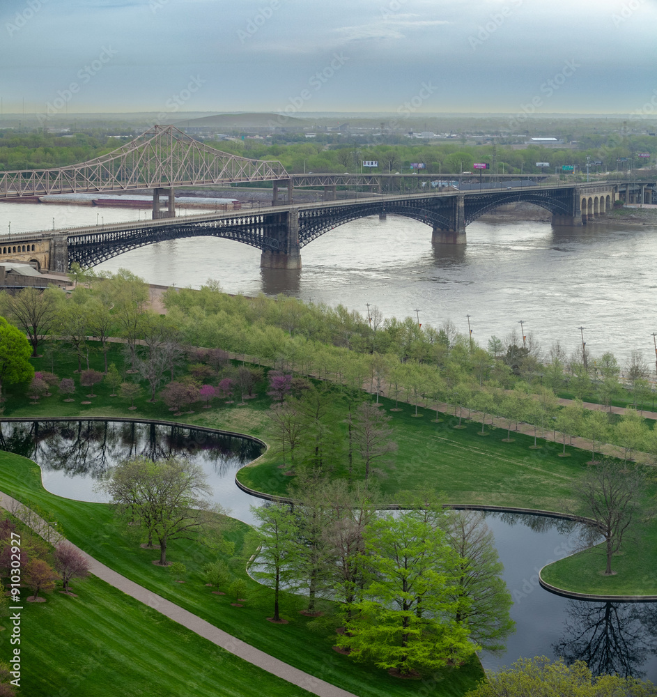Ariel view of riverfront in St Louis with view of Gateway Arches National Park and Eads Bridge on Mississippi River