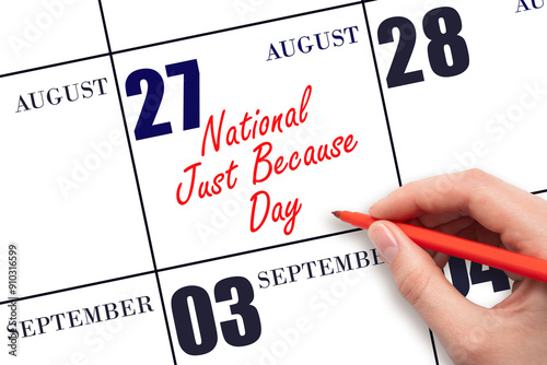 August 27. Hand writing text National Just Because Day on calendar date. Save the date.