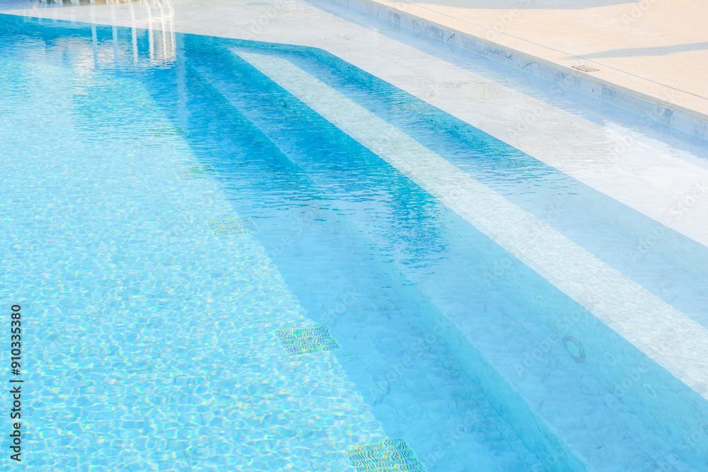 Obraz premium Empty swimming pool with sunbed and white umbrella in resort hotel for vacation leisure and white sand,resort neary sea and beach in summer..