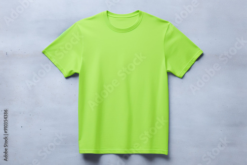 Neon Green Shirt Mockup on Concrete Wall Background: Blank Light Green T-Shirt Mockup Unisex for Branding, Fashion Design, and Product Display
