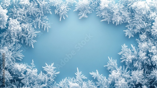 Decorative ice crystals forming a frosty frame on a smooth background, winter theme.