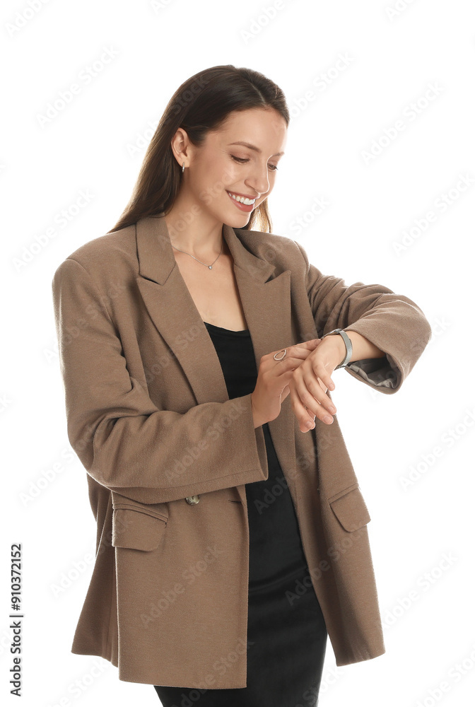 Beautiful woman in stylish brown jacket and black dress checking time on white background Beautiful woman in stylish brown jacket and black dress checking time on white background