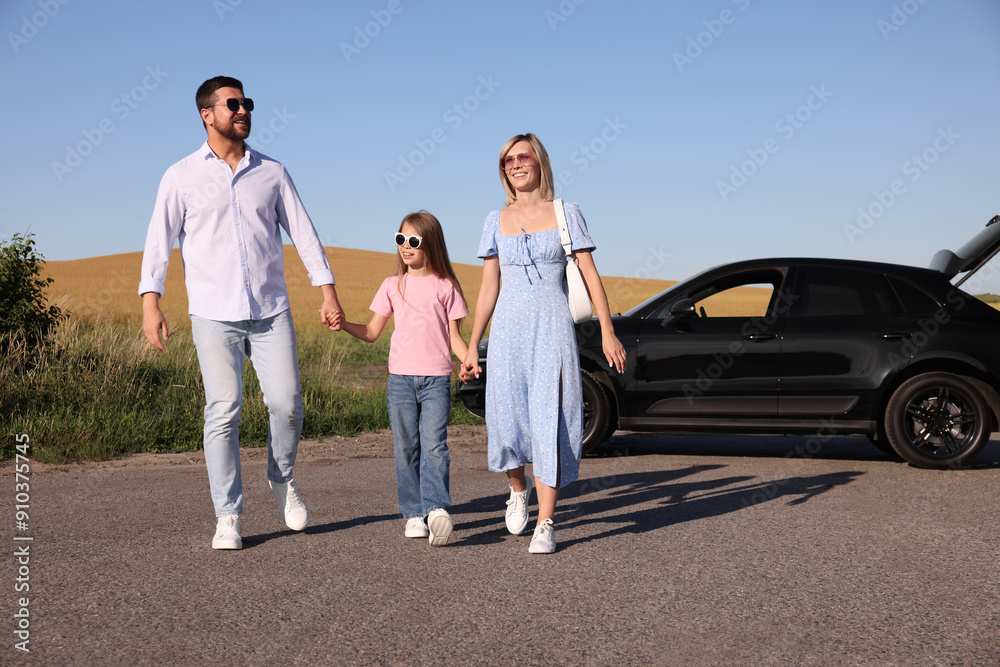 Parents, their daughter and car outdoors. Family traveling Parents, their daughter and car outdoors. Family traveling