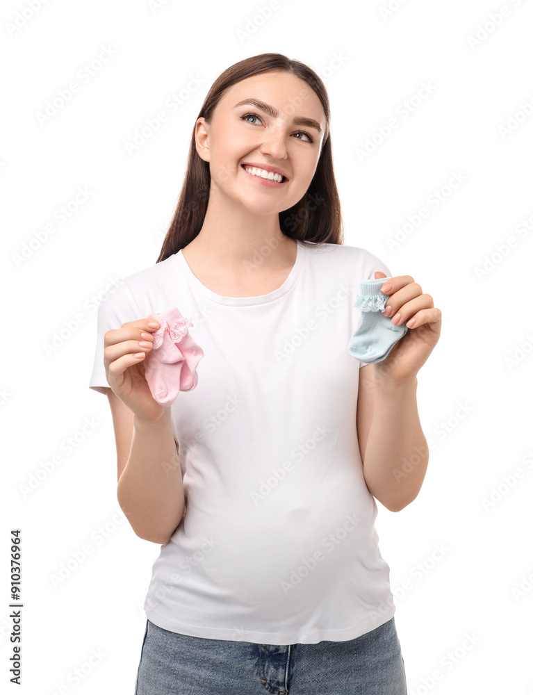 Expecting twins. Pregnant woman holding two pairs of socks on white background