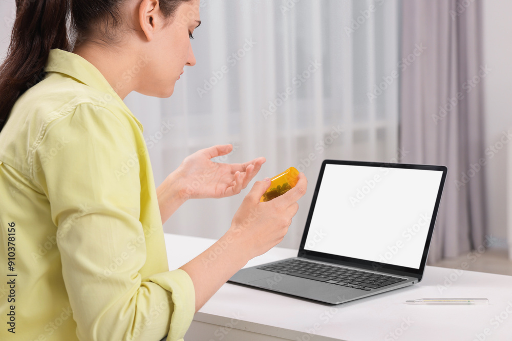 Sick woman having online consultation with doctor via laptop at white table indoors Sick woman having online consultation with doctor via laptop at white table indoors