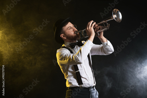 Photography Professional musician playing trumpet on black background in color lights and sm