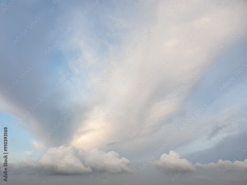 Obraz premium The blue color sky with dark white clouds. The natural sky with clouds.