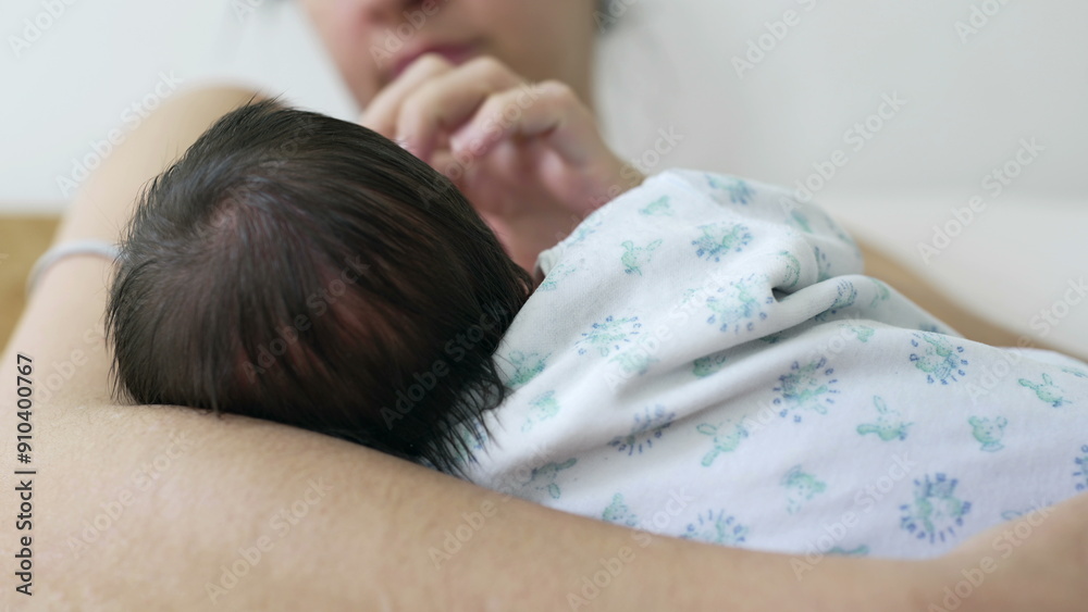 Intimate close-up of a mother nursing and bonding with her newborn baby in her arms during the crucial first days of life. mom caressing infant white breastfeeding Intimate close-up of a mother nursing and bonding with her newborn baby in her arms during the crucial first days of life. mom caressing infant white breastfeeding