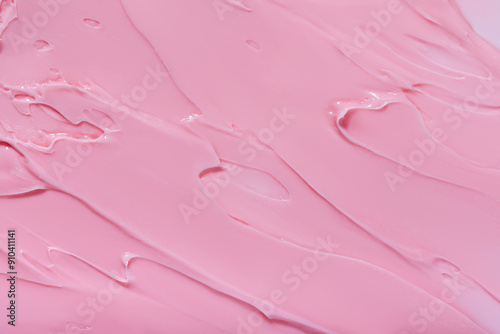 Background swatch texture of pink cream cray, or lipstick cosmetics for face and body . Drop smear kaolin