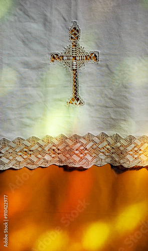 Colorful light spots on the altar  cover. Sunlight filtered through the stained glass window in church. A game of light and shadow. Christian religious holiday celebration background.