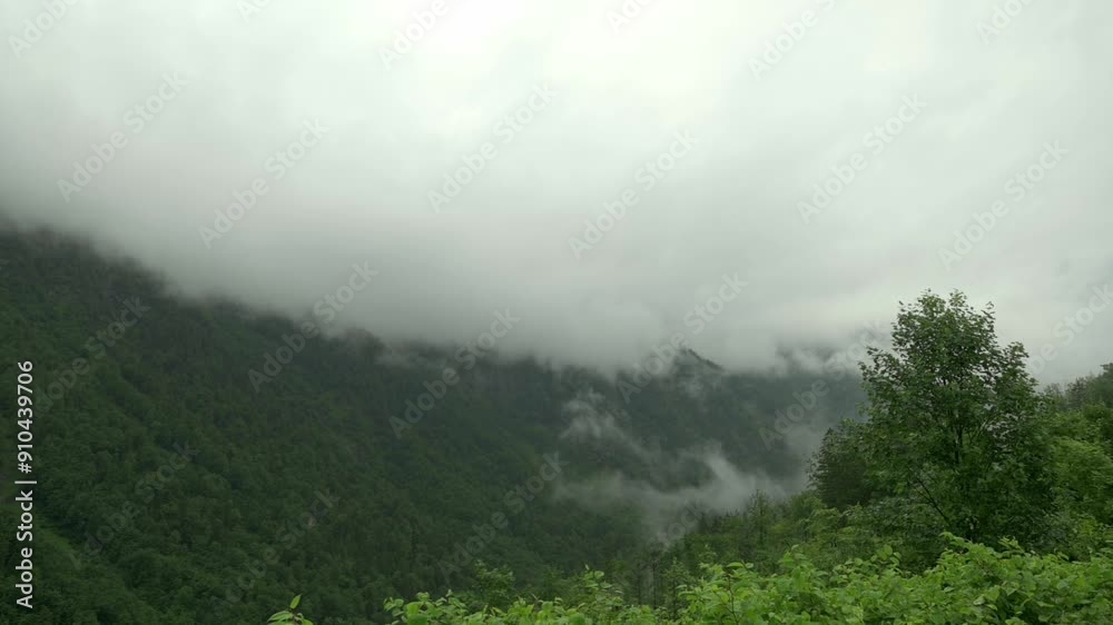 A foggy hillside covered in lush greenery near Hallstatt, Austria, under an overcast sky. High quality 4k footage A foggy hillside covered in lush greenery near Hallstatt, Austria, under an overcast sky. High quality 4k footage