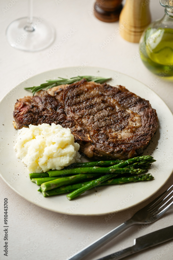ribeye steak with asparagus and mushed potato