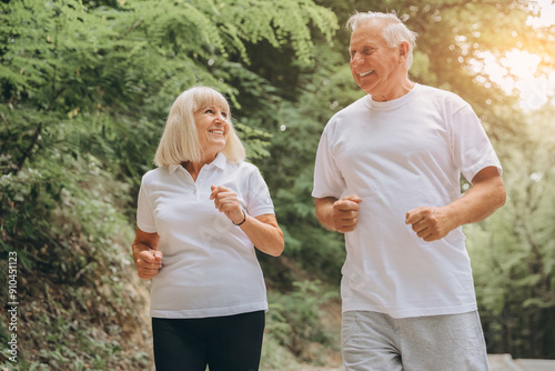 Running, sunshine and senior couple with fitness, exercise and bonding together with challenge. People in park, old man or mature woman with training, retirement and wellness with smile or lens flare