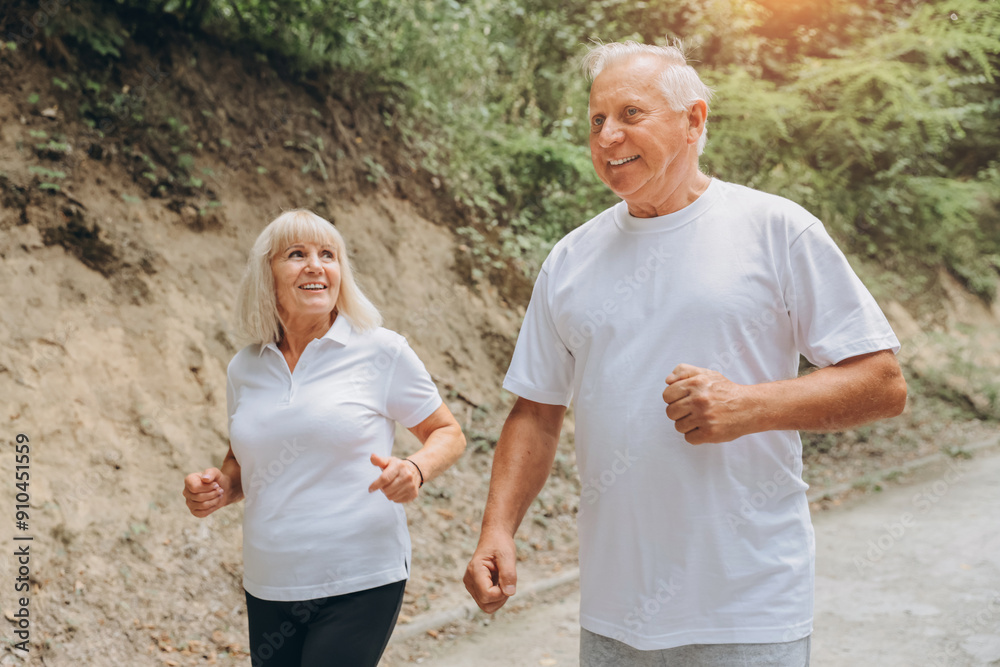 Running, sunshine and senior couple with fitness, exercise and bonding together with challenge. People in park, old man or mature woman with training, retirement and wellness with smile or lens flare Running, sunshine and senior couple with fitness, exercise and bonding together with challenge. People in park, old man or mature woman with training, retirement and wellness with smile or lens flare