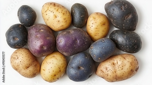 artful arrangement of various potato varieties on white background rustic textures and earthy tones highlight the natural beauty of this humble vegetable photo