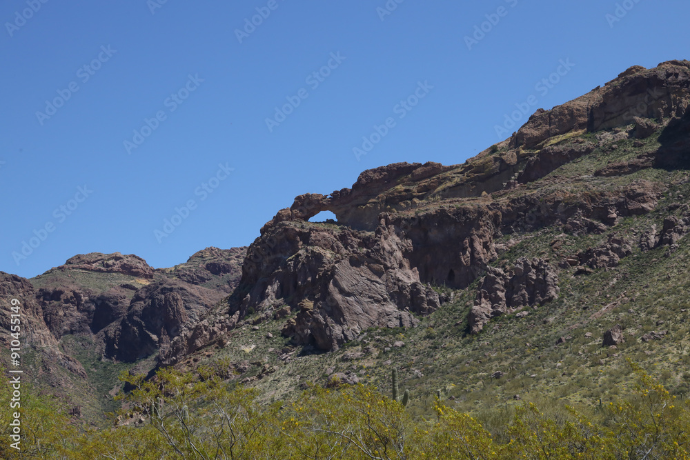 Natural arch and desert landscape at Organ Pipe Cactus National Monument, Arizona Natural arch and desert landscape at Organ Pipe Cactus National Monument, Arizona