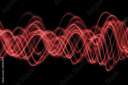 Light Painting Photography - swirly waves of neon light against a black background. Long exposure photograph. 