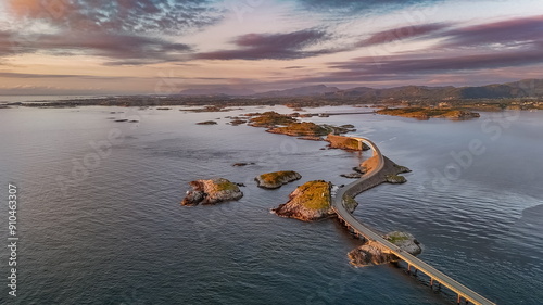 An evening view of the famous Norwegian Atlantic road crossing the ocean over the islands  photo