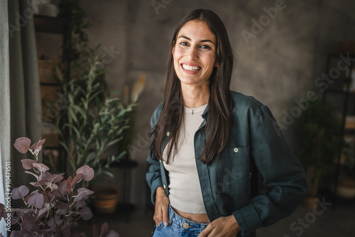 Portrait of adult young women stand and smile at home