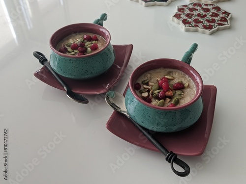 Gourmet Indian vermicelli dessert served in artisanal dessert bowls with pomegranate and dry fruits toppings photo