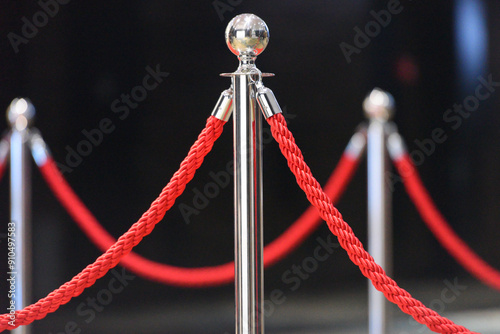 Ceremonial fence. Silver stanless stanchion with red rope barrier - access control photo