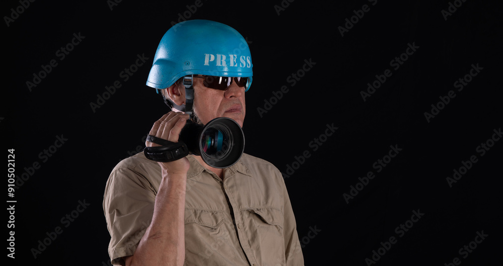 portrait of a man military press with video camera on black background portrait of a man military press with video camera on black background
