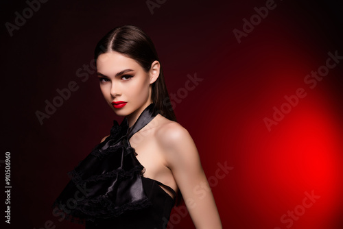 Photo of lady wear black evening gown look in camera stand copyspace isolated red color background