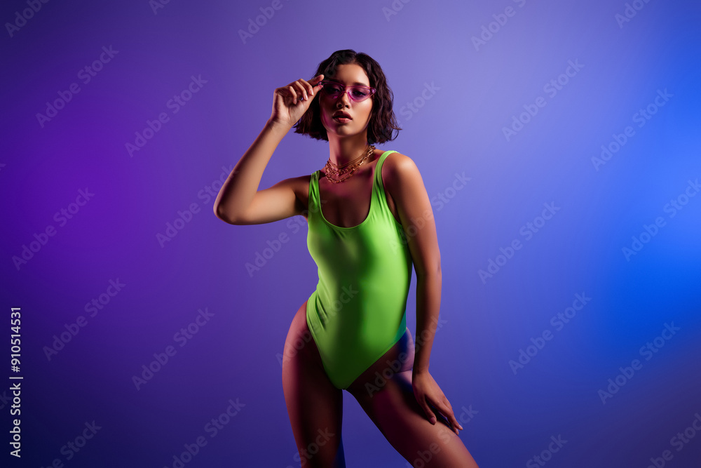 Photo of attractive girl touch wear pink glasses look posing isolated gradient vivid color background Photo of attractive girl touch wear pink glasses look posing isolated gradient vivid color background