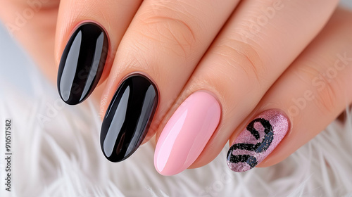 Stylish nail art showcasing elegant black and pink manicure with shimmering details. Beautifully designed nails featuring intricate patterns and glossy finishes