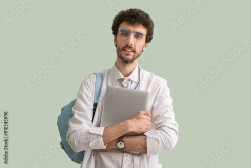 Male student with laptop on...