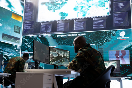 Obraz na plátně Army intelligence officers use modern computer systems and satellite data to bolster national security, process critical information and support strategic planning