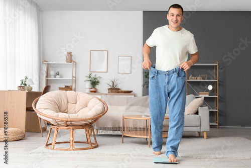 Young man in loose jeans me...