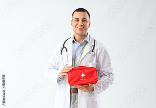 Smiling male doctor in whit...