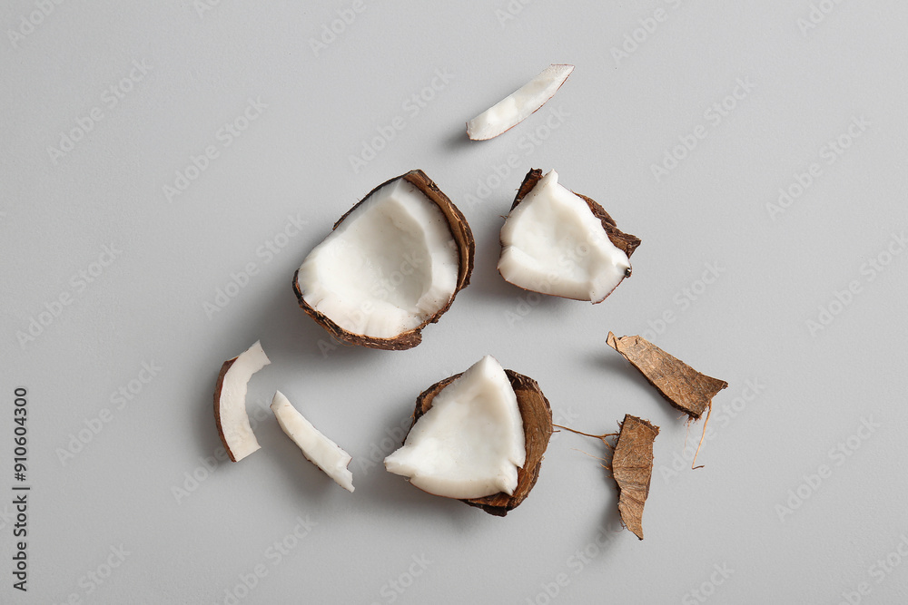 Pieces of fresh coconut on grey background