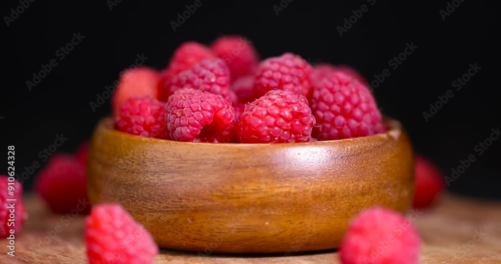 ripe red raspberries on the table, homemade harvest of ripe and healthy raspberries for food