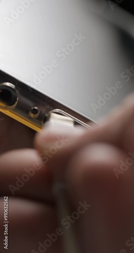 USB-C cable macro plugin to smartphone slow motion, vertical view