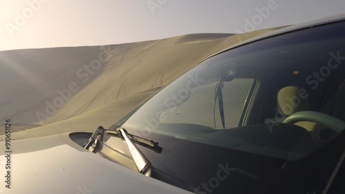 a car with working wipers in the desert photo